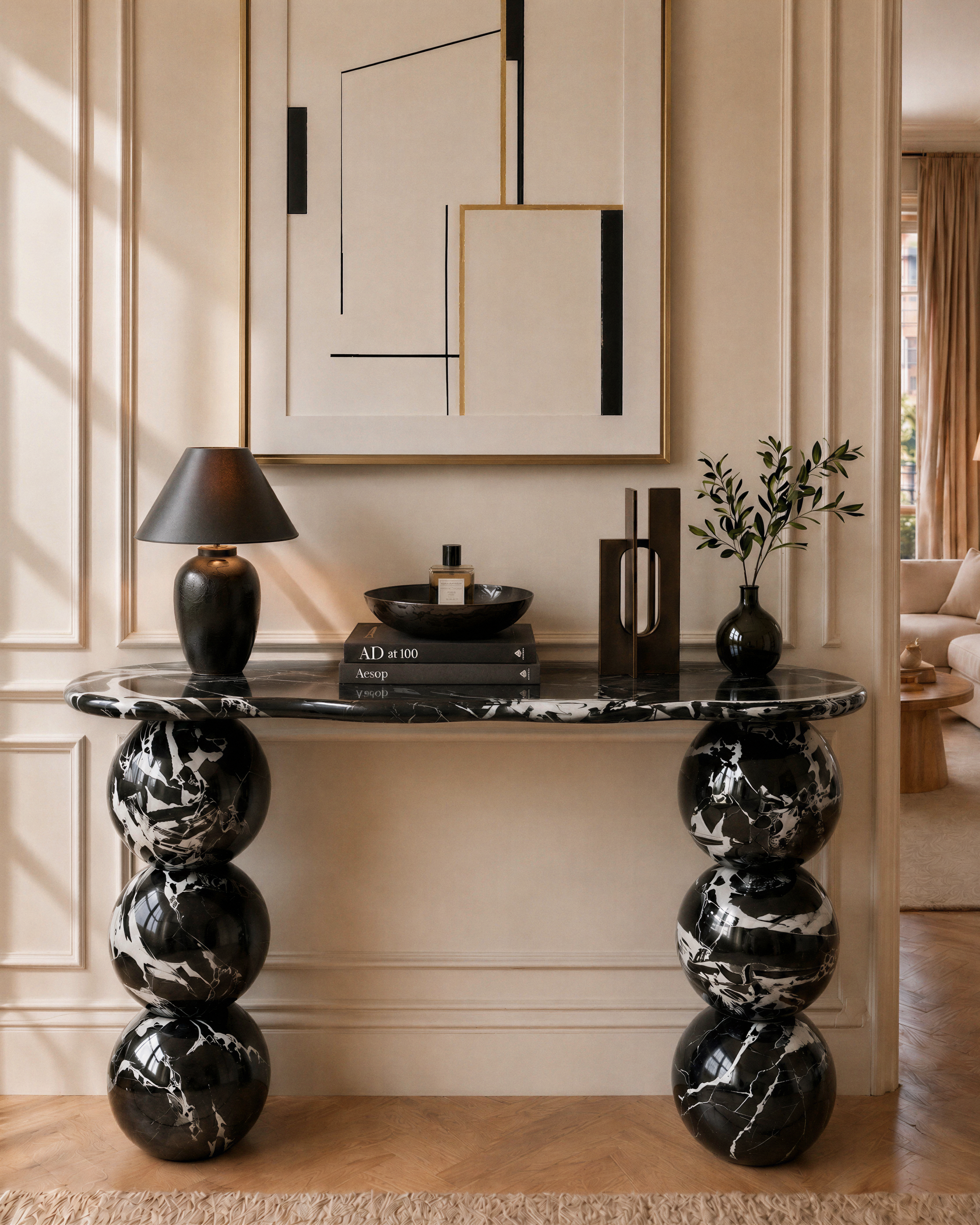 Molitor console in Nero Antico marble, styled in a Parisian entryway